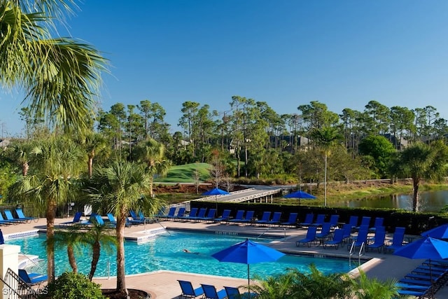 20051 Seagrove St Unit 1206, Estero, FL 33928 - community pool featuring a patio area and view of scattered trees