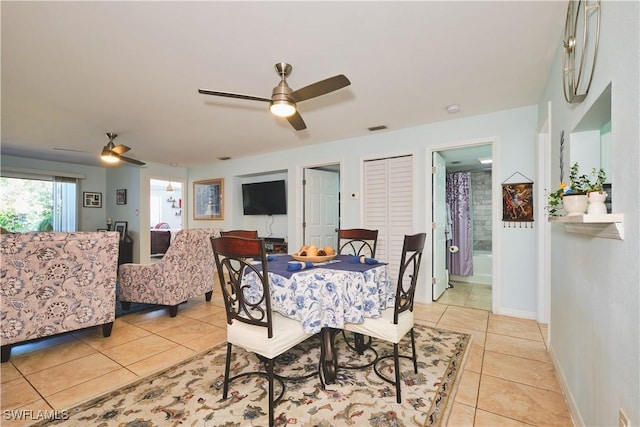 1051 Palm Ave Unit 117, North Fort Myers, FL 33903 - dining area featuring a ceiling fan, light tile patterned floors, and baseboards