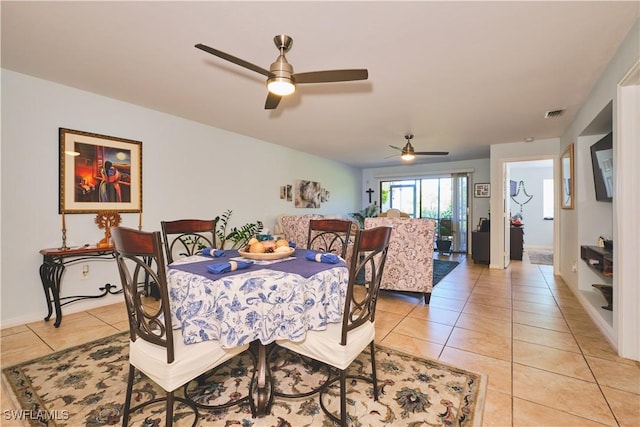 1051 Palm Ave Unit 117, North Fort Myers, FL 33903 - dining space with light tile patterned floors, ceiling fan, and baseboards