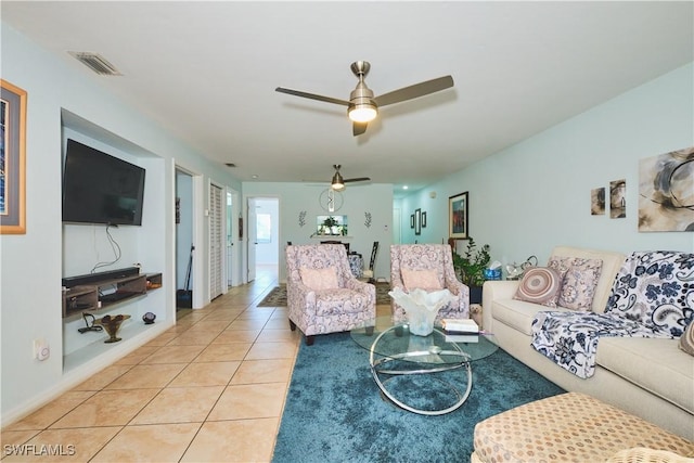 1051 Palm Ave Unit 117, North Fort Myers, FL 33903 - living area featuring light tile patterned flooring and a ceiling fan