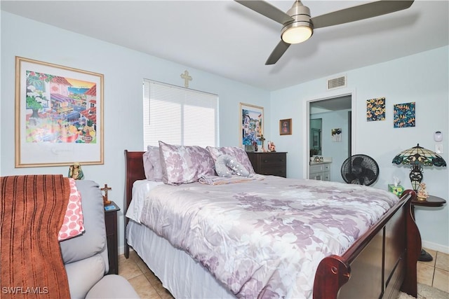 1051 Palm Ave Unit 117, North Fort Myers, FL 33903 - bedroom with light tile patterned floors, baseboards, and ceiling fan