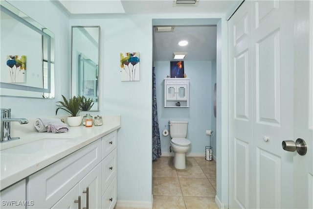 1051 Palm Ave Unit 117, North Fort Myers, FL 33903 - full bath featuring vanity, toilet, tile patterned floors, and baseboards