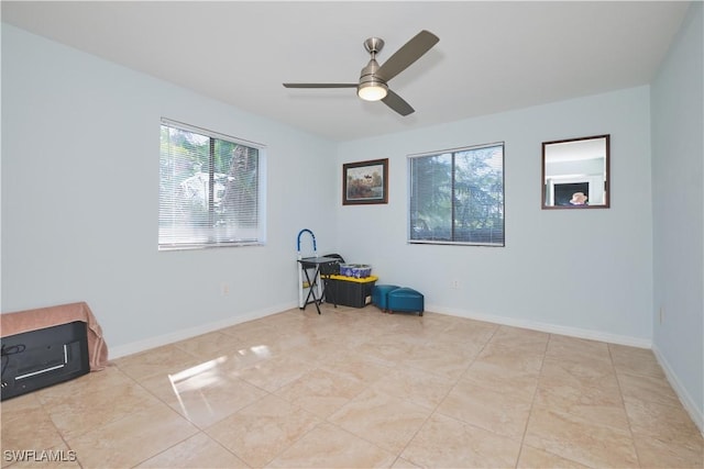 1051 Palm Ave Unit 117, North Fort Myers, FL 33903 - unfurnished room featuring plenty of natural light, ceiling fan, and baseboards