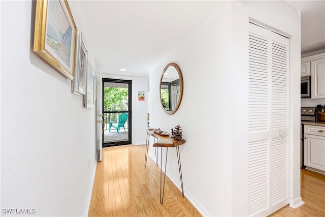 4241 Chantelle Dr Unit D201, Naples, FL 34112 - corridor featuring light wood-style floors, baseboards, and recessed lighting