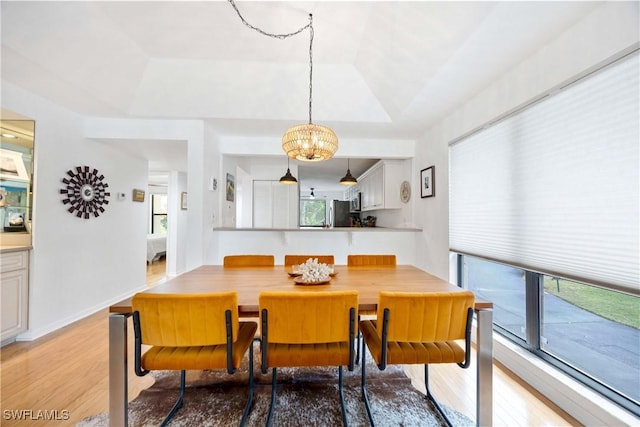 4241 Chantelle Dr Unit D201, Naples, FL 34112 - dining area with light wood-type flooring and plenty of natural light