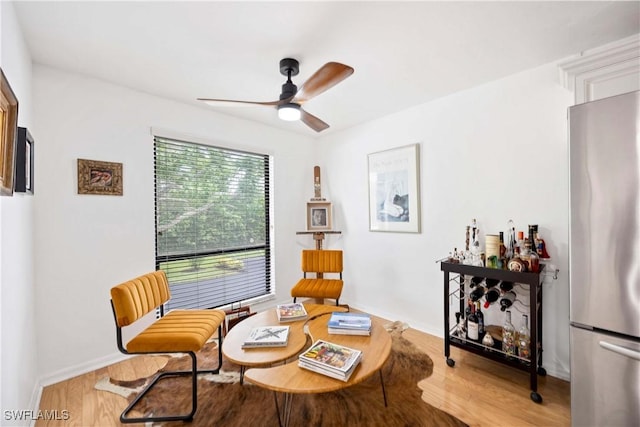 4241 Chantelle Dr Unit D201, Naples, FL 34112 - living area featuring a ceiling fan and wood finished floors