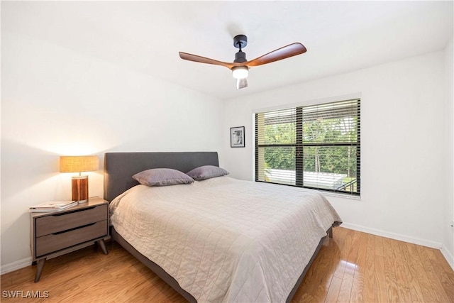 4241 Chantelle Dr Unit D201, Naples, FL 34112 - bedroom featuring light wood finished floors, baseboards, and ceiling fan