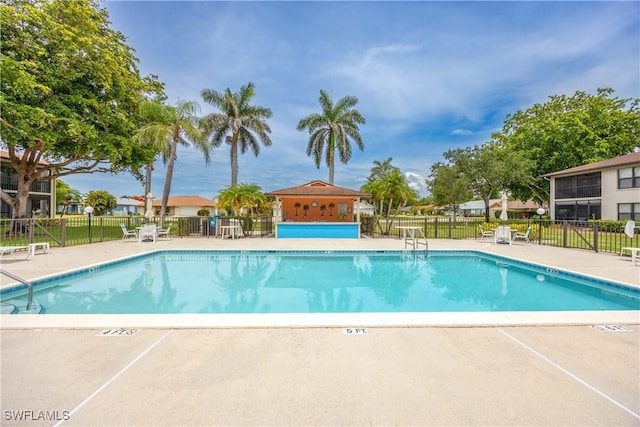 4241 Chantelle Dr Unit D201, Naples, FL 34112 - community pool featuring a patio area