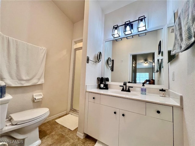 19915 Lake Vista Cir Unit 15C, Lehigh Acres, FL 33936 - full bathroom with toilet, a shower stall, vanity, tile patterned flooring, and baseboards