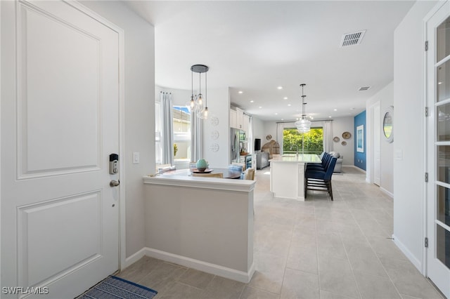 4665 Arboretum Cir Unit 101, Naples, FL 34112 - entrance foyer with baseboards, recessed lighting, and light tile patterned floors