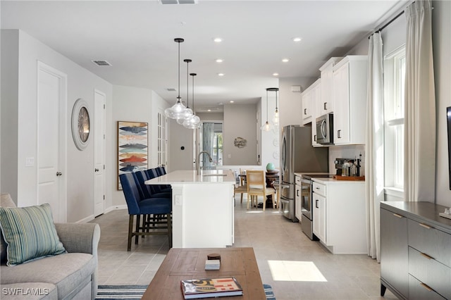 4665 Arboretum Cir Unit 101, Naples, FL 34112 - living area with light tile patterned floors and recessed lighting
