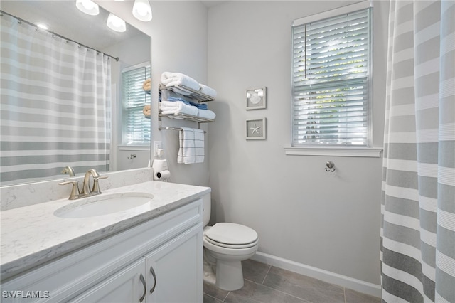 4665 Arboretum Cir Unit 101, Naples, FL 34112 - bathroom featuring vanity, toilet, tile patterned floors, baseboards, and a shower with shower curtain