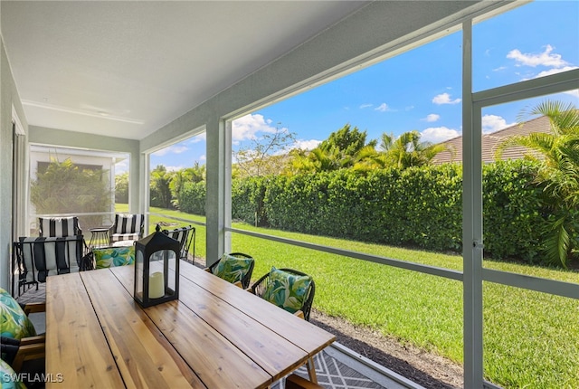 4665 Arboretum Cir Unit 101, Naples, FL 34112 - sunroom with outdoor dining area