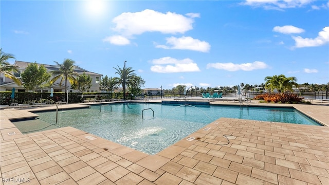 4665 Arboretum Cir Unit 101, Naples, FL 34112 - community pool featuring a patio area
