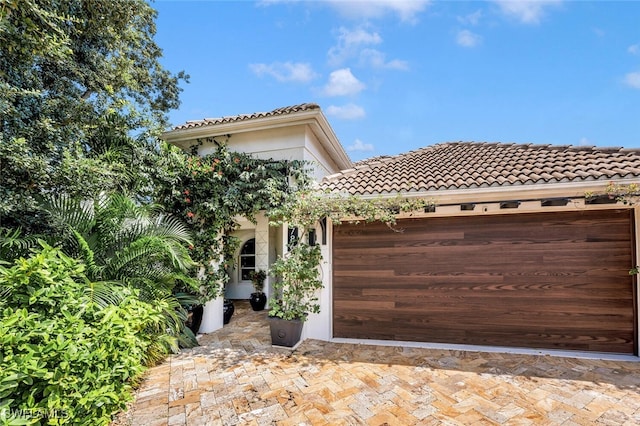 786 109th Ave N, Naples, FL 34108 - mediterranean / spanish-style house with a tile roof and a garage