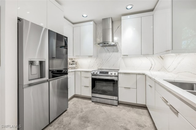 786 109th Ave N, Naples, FL 34108 - kitchen with stainless steel appliances, wall chimney exhaust hood, modern cabinets, white cabinetry, and backsplash