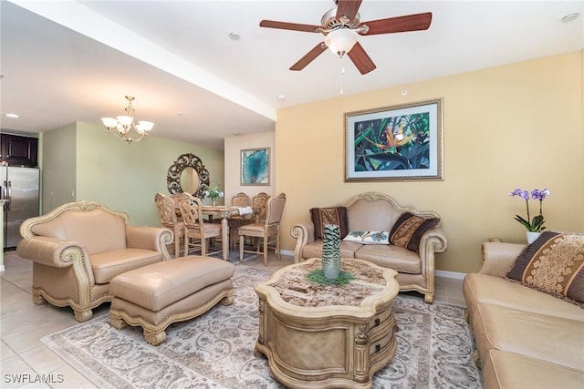 8570 Evernia Ct Unit 101, Estero, FL 34135 - living room with ceiling fan, light tile patterned floors, a chandelier, and baseboards