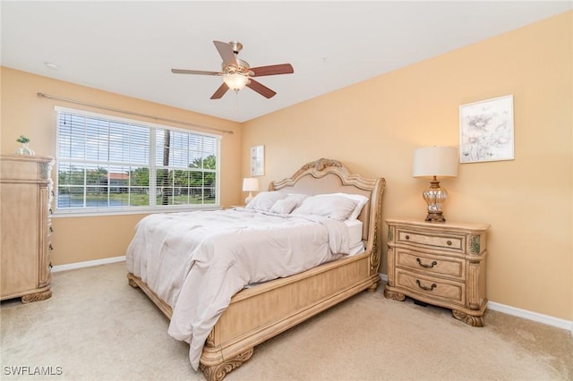 8570 Evernia Ct Unit 101, Estero, FL 34135 - bedroom featuring light carpet, baseboards, and a ceiling fan