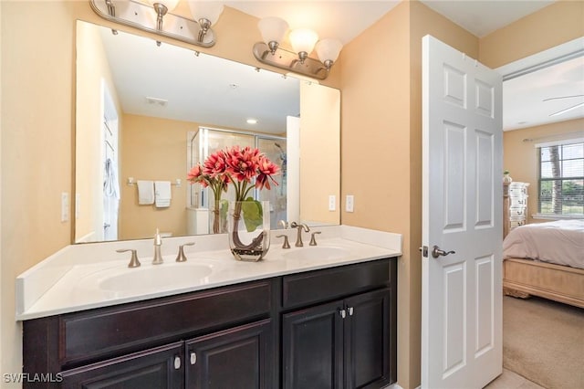 8570 Evernia Ct Unit 101, Estero, FL 34135 - ensuite bathroom with double vanity and an enclosed shower