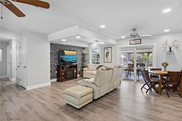 3500 Liberty St, Port Charlotte, FL 33948 - living area featuring a ceiling fan, light wood-style flooring, plenty of natural light, and recessed lighting