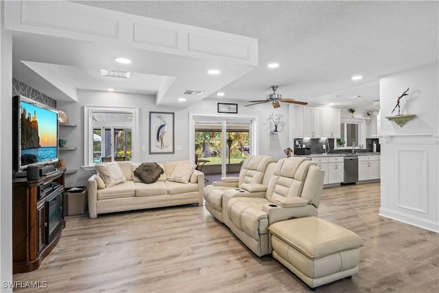3500 Liberty St, Port Charlotte, FL 33948 - living area with light wood-style floors, ceiling fan, recessed lighting, and a textured ceiling