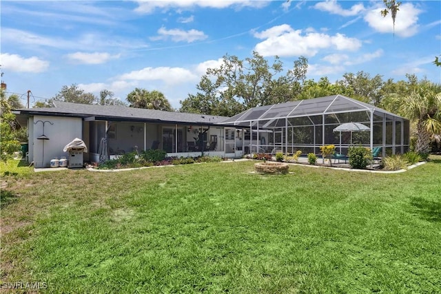 3500 Liberty St, Port Charlotte, FL 33948 - rear view of house with a yard and glass enclosure