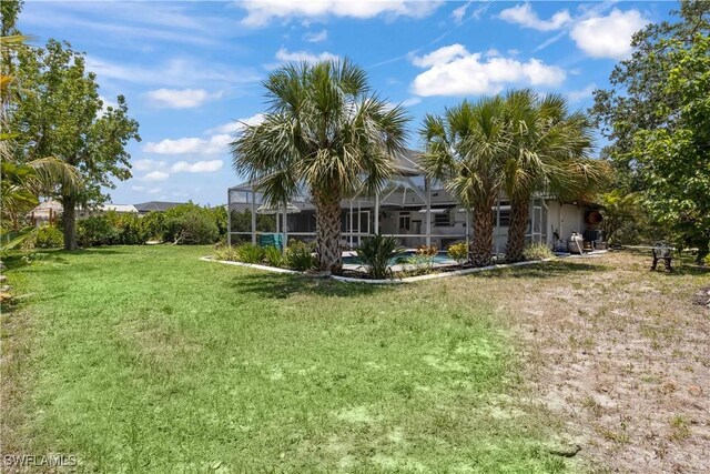 3500 Liberty St, Port Charlotte, FL 33948 - view of grassy yard featuring glass enclosure