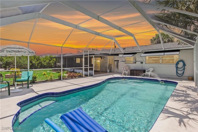 3500 Liberty St, Port Charlotte, FL 33948 - outdoor pool featuring a patio area and glass enclosure