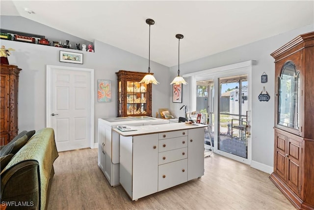 923 SW 4th Pl, Cape Coral, FL 33991 - kitchen with vaulted ceiling, light wood-type flooring, hanging light fixtures, baseboards, and light countertops
