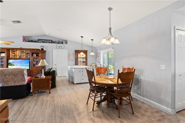 923 SW 4th Pl, Cape Coral, FL 33991 - dining room with light wood-style floors, vaulted ceiling, a chandelier, baseboards, and a ceiling fan