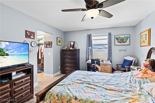 923 SW 4th Pl, Cape Coral, FL 33991 - bedroom with baseboards, a ceiling fan, and wood finished floors