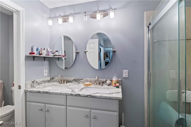 923 SW 4th Pl, Cape Coral, FL 33991 - bathroom with toilet, double vanity, and a shower stall