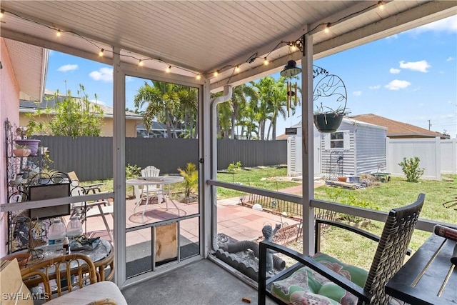 923 SW 4th Pl, Cape Coral, FL 33991 - sunroom with rail lighting and outdoor dining space