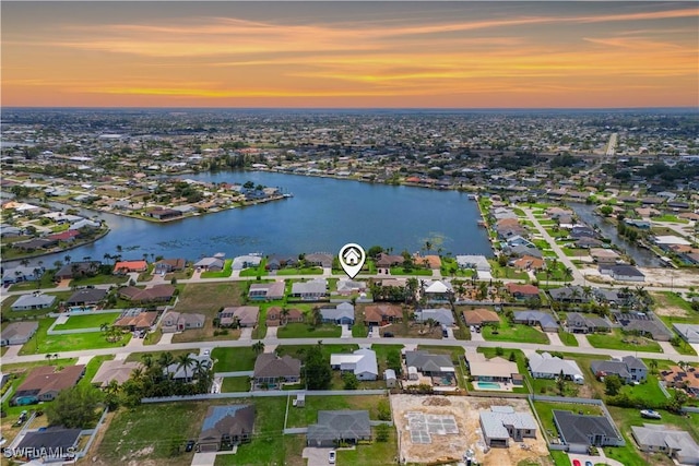 923 SW 4th Pl, Cape Coral, FL 33991 - aerial view at dusk of a water view and a residential view