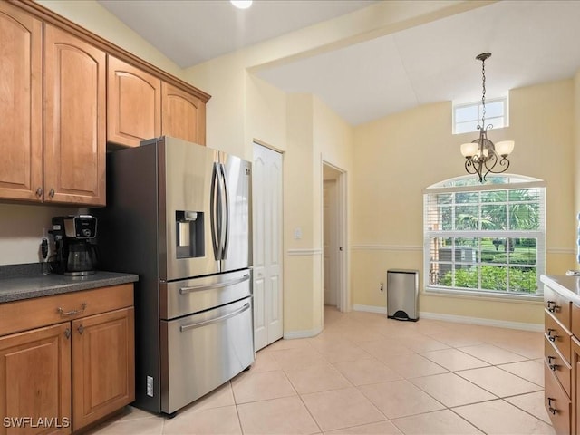 15137 Cortona Way, Naples, FL 34120 - kitchen featuring stainless steel refrigerator with ice dispenser, a chandelier, baseboards, decorative light fixtures, and light tile patterned floors