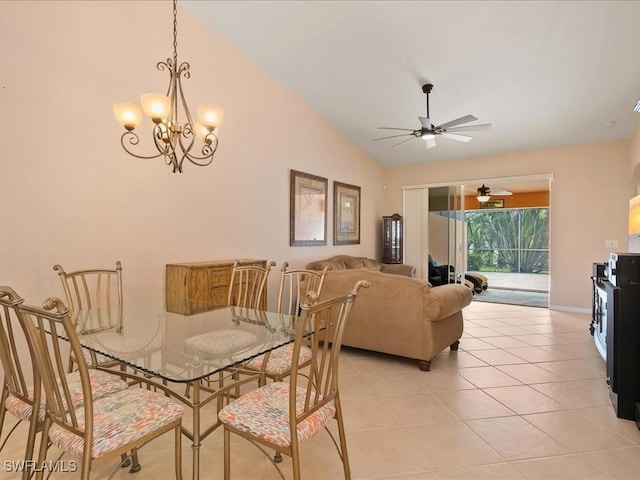 15137 Cortona Way, Naples, FL 34120 - dining area featuring lofted ceiling, light tile patterned floors, a ceiling fan, a chandelier, and baseboards
