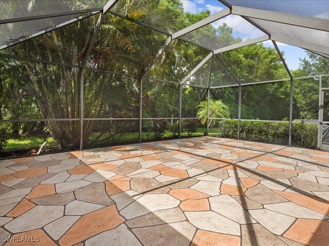 15137 Cortona Way, Naples, FL 34120 - view of patio featuring glass enclosure