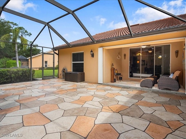 15137 Cortona Way, Naples, FL 34120 - rear view of house featuring a tile roof, stucco siding, and a patio area