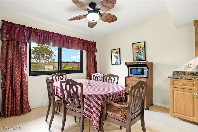 27771 Hacienda E Blvd Unit 223A, Bonita Springs, FL 34135 - dining space with light tile patterned floors, ceiling fan, and baseboards