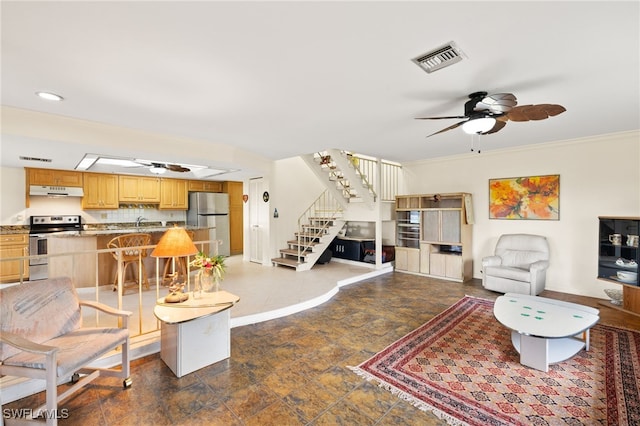 27771 Hacienda E Blvd Unit 223A, Bonita Springs, FL 34135 - living room featuring a ceiling fan, stairs, dark stone finish flooring, baseboards, and crown molding