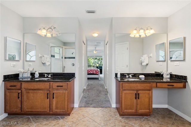 5119 SW 20th Ave, Cape Coral, FL 33914 - bathroom with baseboards, a shower stall, tile patterned floors, and two vanities