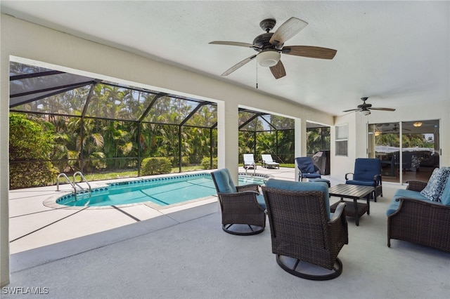 5119 SW 20th Ave, Cape Coral, FL 33914 - swimming pool with ceiling fan, a patio area, and an outdoor living space