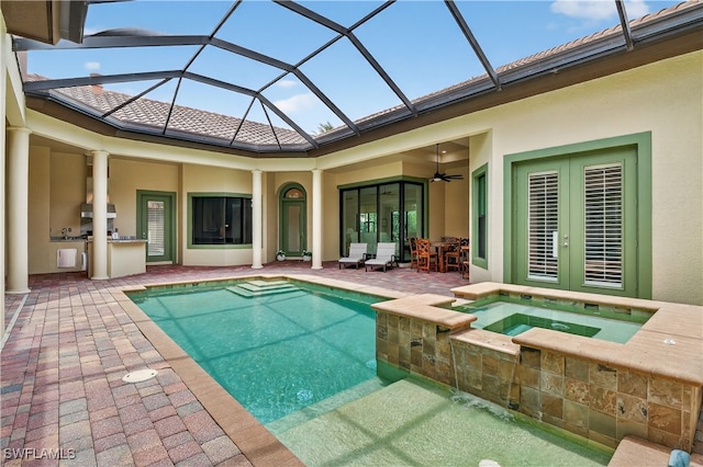 6528 Costa Cir, Naples, FL 34113 - view of pool featuring exterior kitchen, a patio, french doors, glass enclosure, and ceiling fan