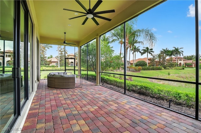 6528 Costa Cir, Naples, FL 34113 - sunroom with ceiling fan and an outdoor living space