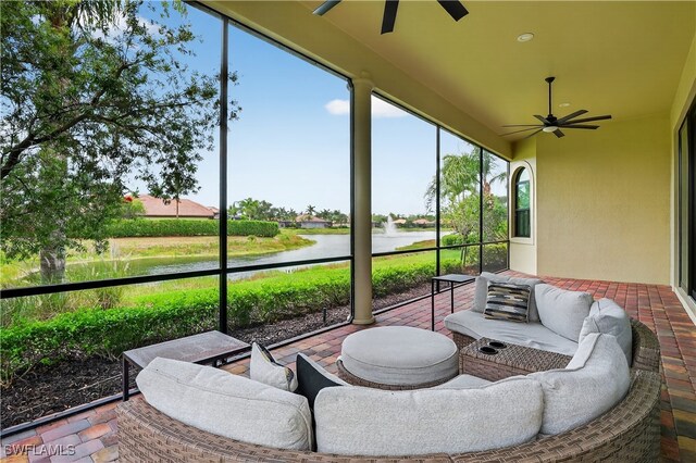 6528 Costa Cir, Naples, FL 34113 - sunroom featuring ceiling fan and a water view