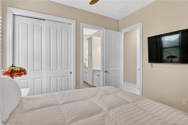 6528 Costa Cir, Naples, FL 34113 - bedroom featuring a closet, ceiling fan, and connected bathroom