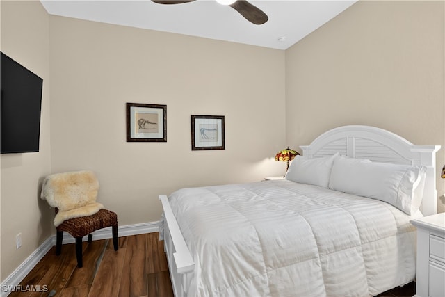 6528 Costa Cir, Naples, FL 34113 - bedroom with baseboards, dark wood finished floors, and a ceiling fan