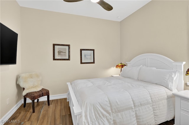 6528 Costa Cir, Naples, FL 34113 - bedroom featuring baseboards, wood finished floors, and a ceiling fan