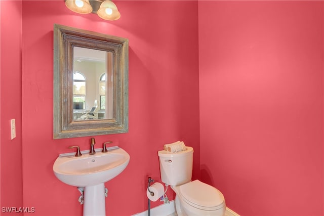 6528 Costa Cir, Naples, FL 34113 - bathroom with toilet and baseboards