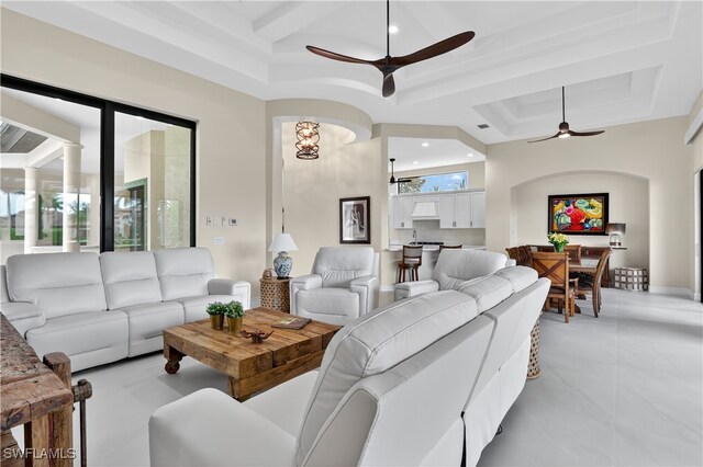 6528 Costa Cir, Naples, FL 34113 - living room with a ceiling fan, coffered ceiling, recessed lighting, a tray ceiling, and beam ceiling